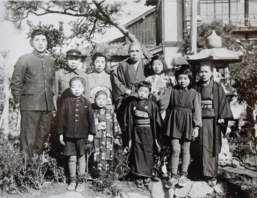 kenzo takada 7 At our home in 1948. I am at the left end of the front row. My mother is in the back row third from the left with my father to the right of her.